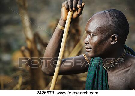 Young Suri (Surma) man in village of Kibish, Omo region, Southwest Ethiopia; Kibish, Ethiopia View Large Photo Image Stock Photo - Young Suri (Surma) man in village of Kibish, Omo region, Southwest Ethiopia; Kibish, Ethiopia. Fotosearch