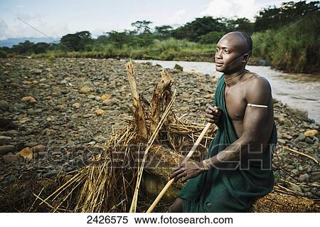 Young Suri (Surma) man in village of Kibish, Omo region, Southwest Ethiopia; Kibish, Ethiopia View Large Photo Image Stock Photography - Young Suri (Surma) man in village of Kibish, Omo region, Southwest Ethiopia; Kibish, Ethiopia. Fotosearch