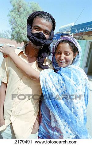 Stock Image - Young Tuareg Couple In Tamanrasset (The Capital Of The Tuareg Nation). Sahara Desert (Southern Algeria).. Fotosearch