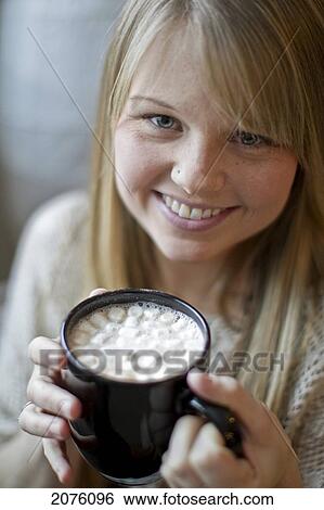 Young Woman Drinking Hot Chocolate With Marshmallows View Large Photo Image Stock Photograph - Young Woman Drinking Hot Chocolate With Marshmallows. Fotosearch