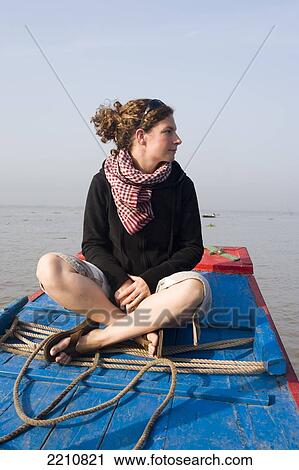 Young Woman Enjoying A Boat Trip In The Mekong Delta Close To Vinh Long, Vietnam. View Large Photo Image Stock Image - Young Woman Enjoying A Boat Trip In The Mekong Delta Close To Vinh Long, Vietnam.. Fotosearch