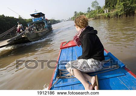 Young Woman Enjoying Boat Trip In Mekong Delta, Vinh Long, Vietnam View Large Photo Image Stock Photograph - Young Woman Enjoying Boat Trip In Mekong Delta, Vinh Long, Vietnam. Fotosearch