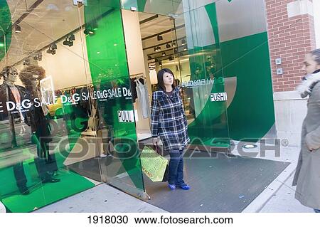 Young Woman Exiting Dolce And Gabbana View Large Photo Image Stock Image - Young Woman Exiting Dolce And Gabbana. Fotosearch