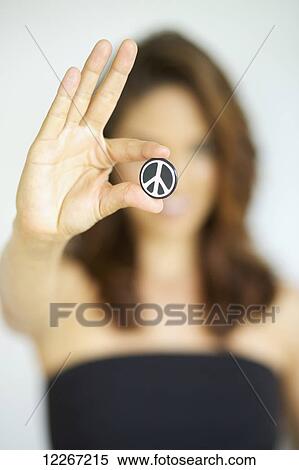 Young woman holding peace symbol; Kauai, Hawaii, United States of America View Large Photo Image Stock Photography - Young woman holding peace symbol; Kauai, Hawaii, United States of America. Fotosearch