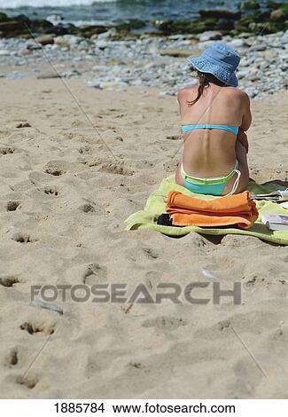 Young Woman In Bikini Sitting On Towel At The Beach View Large Photo Image Picture - Young Woman In Bikini Sitting On Towel At The Beach. Fotosearch