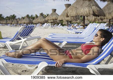 Stock Photography - Young Woman In Bikini Sunbathing On Beach At Mayan Riviera, Yucatan Peninsular, Quintana Roo State, Mexico. Fotosearch