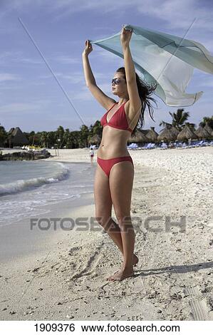 Stock Photograph - Young Woman In Bikini With Sarong On Beach At Mayan Riviera, Yucatan Peninsular, Quintana Roo State, Mexico. Fotosearch