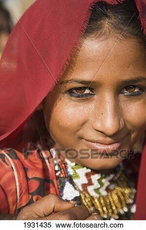 Stock Photography - Young Woman In Traditional Red Sari; Pushkar, Rajasthan, India. Fotosearch