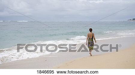 Stock Photography - Young Woman On Sandy Beach. Fotosearch