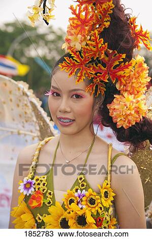 Young Woman Participating In Flower Festival, Chiang Mai, Thailand View Large Photo Image Stock Image - Young Woman Participating In Flower Festival, Chiang Mai, Thailand. Fotosearch