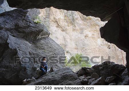 Young woman sitting in caves of La Bufa; Guanajuato, Guanajuato State, Mexico View Large Photo Image Stock Photo - Young woman sitting in caves of La Bufa; Guanajuato, Guanajuato State, Mexico. Fotosearch