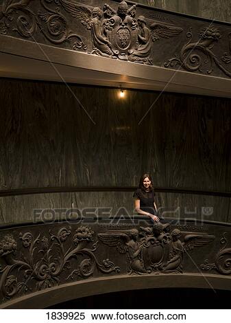 Stock Photography - Young Woman Standingon Staircase In Vatican Museum; Vatican, Rome, Italy. Fotosearch