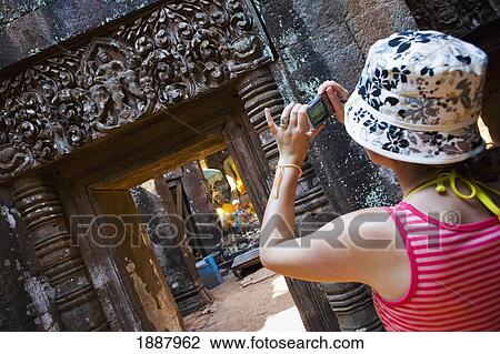 Young Woman Taking Photos Of The Ruins At Wat Phu. View Large Photo Image Stock Image - Young Woman Taking Photos Of The Ruins At Wat Phu.. Fotosearch