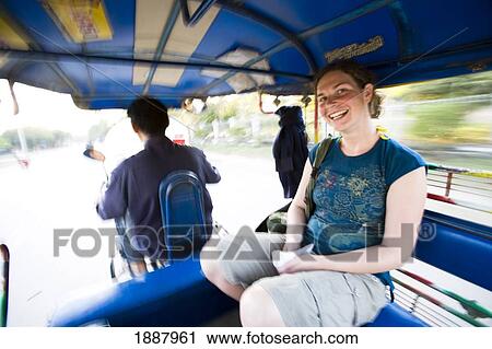 Stock Image - Young Woman Traveller In Tuk-Tuk.. Fotosearch
