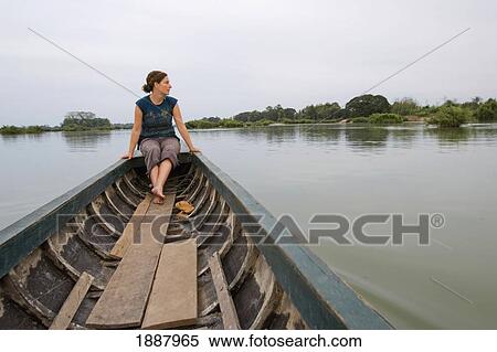 Young Woman Traveller On Boat Trip Amongst The 4000 Islands Of Si Phan Don. View Large Photo Image Stock Photography - Young Woman Traveller On Boat Trip Amongst The 4000 Islands Of Si Phan Don.. Fotosearch