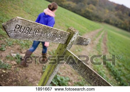 Stock Photo - Young Woman Walking On Field, Autumn. Fotosearch