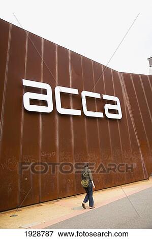 Young Woman Walking Past Australian Centre For Contemporary Art, Southbank, Melbourne, Australia View Large Photo Image Stock Photo - Young Woman Walking Past Australian Centre For Contemporary Art, Southbank, Melbourne, Australia. Fotosearch