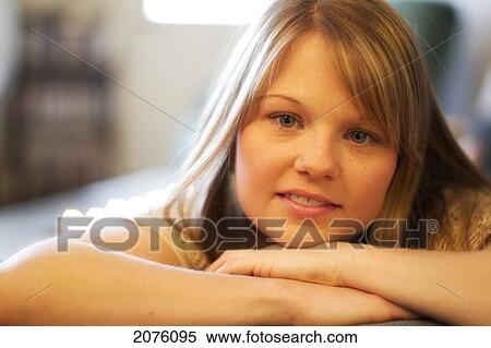 Young Woman With Her Head Propped On Her Arms View Large Photo Image Stock Photography - Young Woman With Her Head Propped On Her Arms. Fotosearch