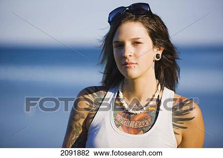 Young Woman With Tattoos Sitting By Lake Simcoe; Ontario Canada View Large Photo Image Stock Image - Young Woman With Tattoos Sitting By Lake Simcoe; Ontario Canada. Fotosearch