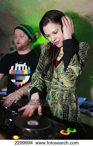 ZOe Griffin spins some tunes at the Pulk Vedis Bar, Riga, Latvia. View Large Photo Image Picture - ZOe Griffin spins some tunes at the Pulk Vedis Bar, Riga, Latvia.. Fotosearch