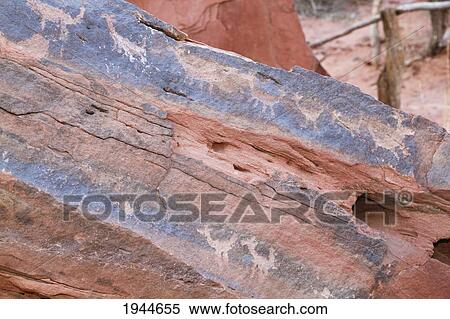 Stock Photography - Zoomorphic petroglyphs on a rock in Talampaya Canyon, Talampaya National Park, La Rioja, Argentina. Fotosearch