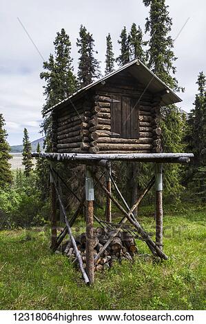 Stock Photograph - A Cache in Denali National Park near an old cabin that is occupied during the summer by a Park worker; Alaska, United States of America. Fotosearch