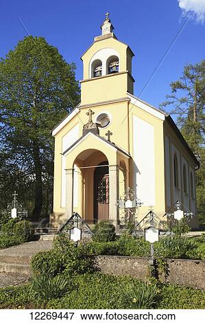 Stock Photo - A church building with blue sky; Bayern, Germany. Fotosearch