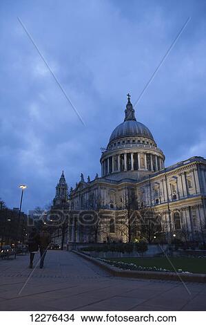 A couple walk arm-in-arm past St Paul's Cathedral at dusk; London, England View Large Photo Image Picture - A couple walk arm-in-arm past St Paul's Cathedral at dusk; London, England. Fotosearch