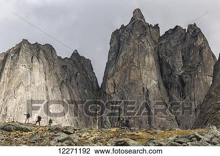 A group of hikers stand in front of the mountains in Tombstone Territorial Park; Yukon Territory, Canada View Large Photo Image Stock Image - A group of hikers stand in front of the mountains in Tombstone Territorial Park; Yukon Territory, Canada. Fotosearch