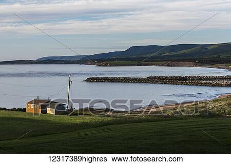 A house and breakwater along the Atlantic coastline, Cape Breton Island; Margaree, Nova Scotia, Canada View Large Photo Image Stock Photograph - A house and breakwater along the Atlantic coastline, Cape Breton Island; Margaree, Nova Scotia, Canada. Fotosearch