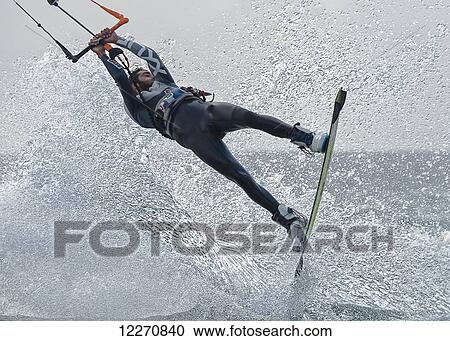 A man kitesurfing; Tarifa, Cadiz, Andalusia, Spain View Large Photo Image Stock Image - A man kitesurfing; Tarifa, Cadiz, Andalusia, Spain. Fotosearch