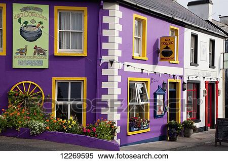 Stock Photography - A purple building with yellow trim; Waterville, County Kerry, Ireland. Fotosearch