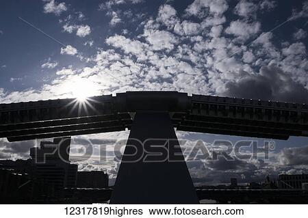 A silhouetted view from Millennium Bridge against a dramatic spring sky; London, England View Large Photo Image Stock Photograph - A silhouetted view from Millennium Bridge against a dramatic spring sky; London, England. Fotosearch