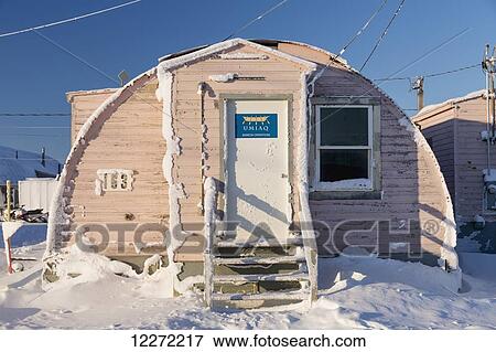 Stock Photo - A Snowy Quonset hut containing the old naval base in Barrow, Arctic Alaska, Winter. Fotosearch