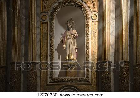 Stock Image - A statue of Jesus Christ in a niche; Benidorm, Spain. Fotosearch
