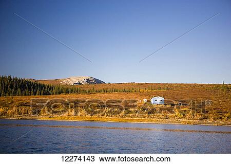 A summer camp house on the banks of the Noatak River as it passes throuth the Igichuk Hills before emptying into Kotzebue Sound, Noatak, Arctic Alaska, USA, Fall View Large Photo Image Stock Image - A summer camp house on the banks of the Noatak River as it passes throuth the Igichuk Hills before emptying into Kotzebue Sound, Noatak, Arctic Alaska, USA, Fall. Fotosearch