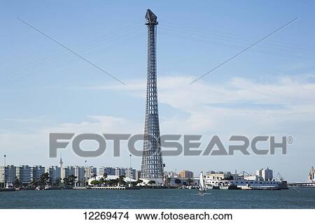 Picture - A tower with cables along the waterfront, near Cadiz; Andalusia, Spain. Fotosearch
