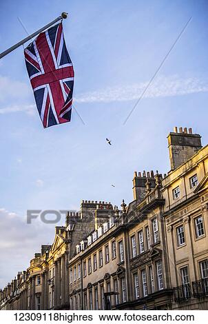 Stock Photograph - A Union Jack flag flying in the streets of Bath; Bath Somerset, England. Fotosearch