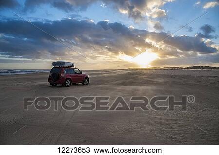 A vehicle sits on Casino Beach at sunset, the longest beach in the world; Rio Grande do Sul, Brazil View Large Photo Image Stock Image - A vehicle sits on Casino Beach at sunset, the longest beach in the world; Rio Grande do Sul, Brazil. Fotosearch