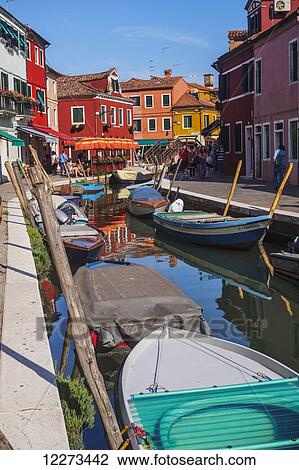 A view of one of the many of narrow canals on Burano Island, the famous lace-making district; Venice, Italy View Large Photo Image Stock Image - A view of one of the many of narrow canals on Burano Island, the famous lace-making district; Venice, Italy. Fotosearch