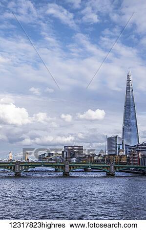 A view of the River Thames and The Shard from Millennium Bridge; Londong, England View Large Photo Image Stock Photograph - A view of the River Thames and The Shard from Millennium Bridge; Londong, England. Fotosearch