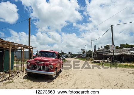 A vintage red truck parked on the sand road; Valizas, Uruguay View Large Photo Image Stock Image - A vintage red truck parked on the sand road; Valizas, Uruguay. Fotosearch