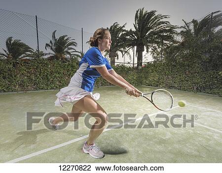 A young woman plays tennis; Tarifa, Cadiz, Andalusia, Spain View Large Photo Image Stock Image - A young woman plays tennis; Tarifa, Cadiz, Andalusia, Spain. Fotosearch