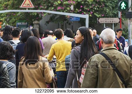 A young woman with backpack among many pedestrians along the busy streets of Kowloon; Hong Kong, China View Large Photo Image Stock Photography - A young woman with backpack among many pedestrians along the busy streets of Kowloon; Hong Kong, China. Fotosearch