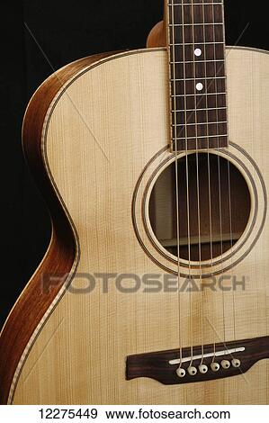 Acoustic guitar from the bridge up to the top of the body; United States of America View Large Photo Image Stock Photo - Acoustic guitar from the bridge up to the top of the body; United States of America. Fotosearch