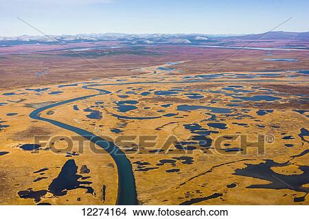 Picture - Aerial of the Noatak River, Igichuk Hills wetlands, and the Baird Mountains in the distance, Noatak, Arctic Alaska, USA, Fall. Fotosearch