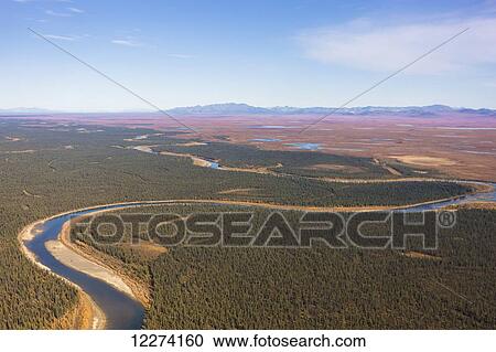 Stock Image - Aerial of the Noatak River, Igichuk Hills and the Baird Mountains in the distance, Noatak, Arctic Alaska, USA, Fall. Fotosearch
