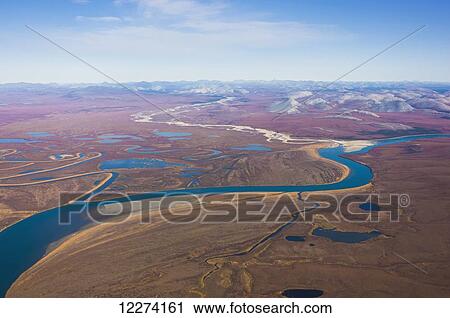 Stock Image - Aerial of the Noatak River, Igichuk Hills and the Baird Mountains in the distance, Noatak, Arctic Alaska, USA, Fall. Fotosearch