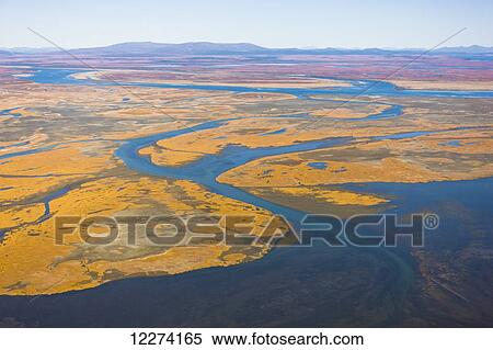 Stock Photography - Aerial of the Noatak River, Igichuk Hills wetlands, and the Baird Mountains in the distance, Noatak, Arctic Alaska, USA, Fall. Fotosearch