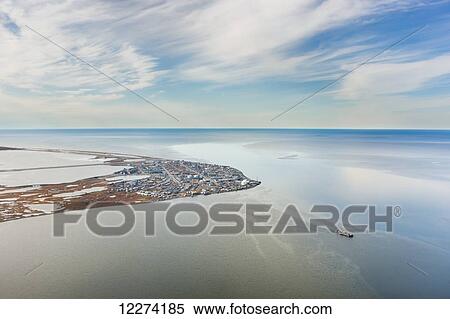 Aerial view of a barge leaving the town of Kotzebue, Baldwin Penninsula, Kotzebue Sound, Arctic Alaska, USA, Fall View Large Photo Image Stock Photography - Aerial view of a barge leaving the town of Kotzebue, Baldwin Penninsula, Kotzebue Sound, Arctic Alaska, USA, Fall . Fotosearch